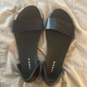 Gently used (worn twice) Torrid black slip on sandals, size 10 wide width
